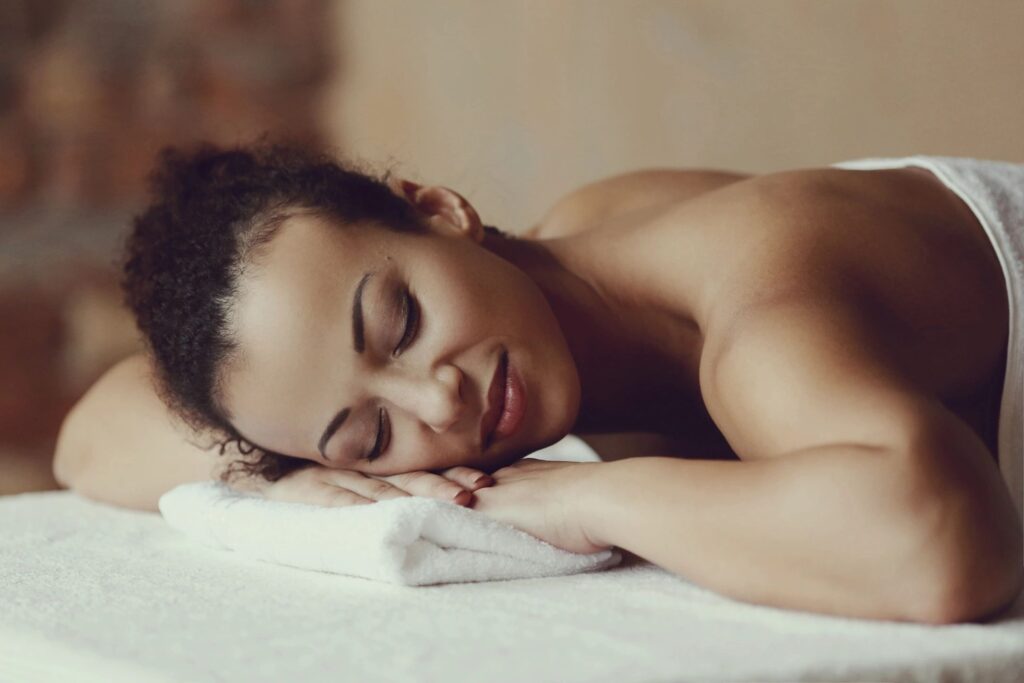 A woman peacefully enjoying a relaxing spa treatment, symbolizing self-care and relaxation for Valentine's Day.